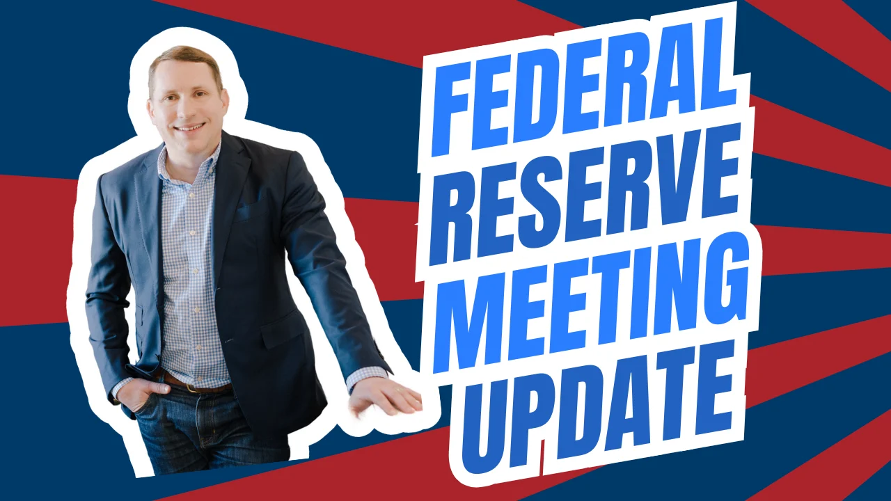 Brandon Yopp, a professional real estate agent in North Carolina’s Triangle region and expert in the Raleigh market, stands confidently in front of a bold red and blue background next to large text reading “Federal Reserve Meeting Update,” representing mortgage rate news and housing market updates for May 2025.